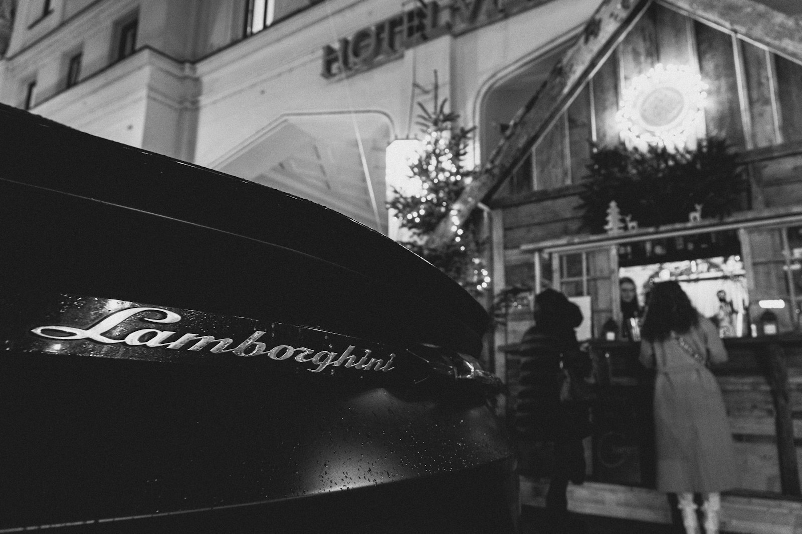 A luxury vehicle delivered to a hotel entrance for arrival